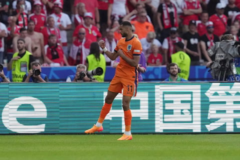 Cody Gakpo celebrates a goal against Austria